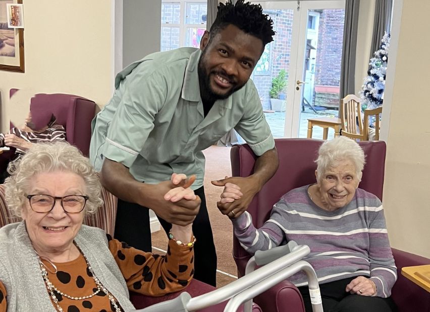 Haughgate House's residents interacting with carer
