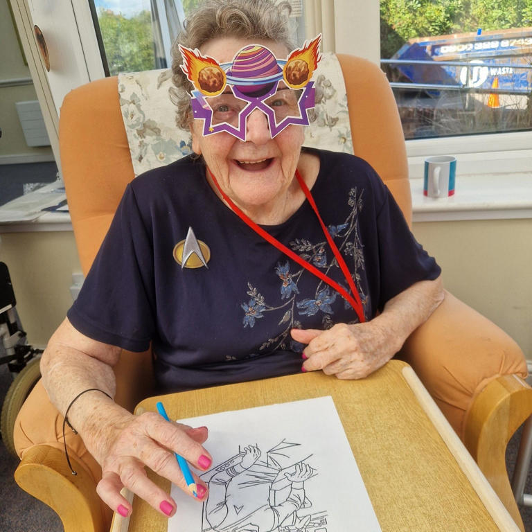 Resident at Bedhampton Court Care Home wearing Star Trek-themed glasses and smiling during Star Trek Day celebrations.